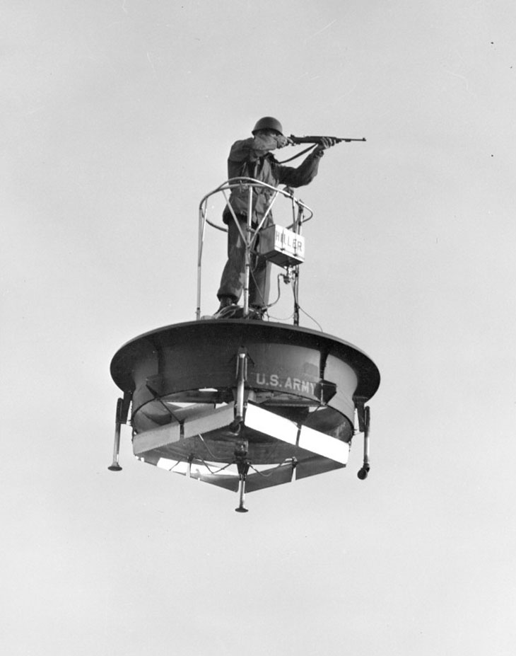 A black and white photo of a soldier on a flying platform