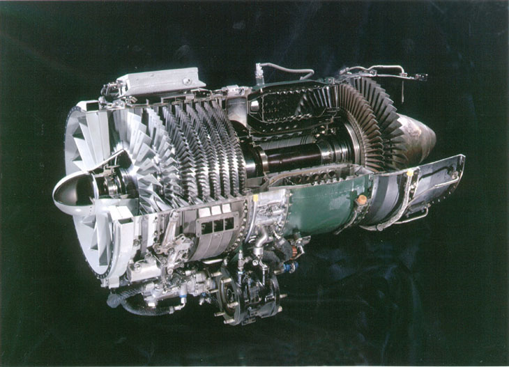 A metal jet engine bisected so one can see the inner workings of the engine.