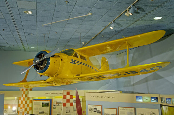 The Beechcraft C17L Staggerwing hanging from the ceiling of the Smithsonian National Air and Space Museum