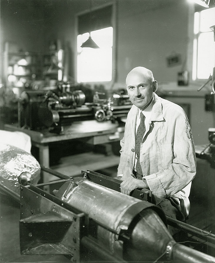 Scientist Robert Goddard sits in his lab