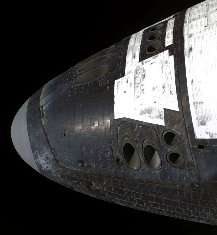 Zoomed in images of a space shuttle’s nose.  Showing many small holes for producing thrust.