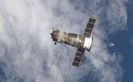 A photo of Russia's Progress Spacecraft above the earth.